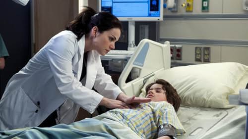 Erica Durance and Jake Goodman in Saving Hope (2012)