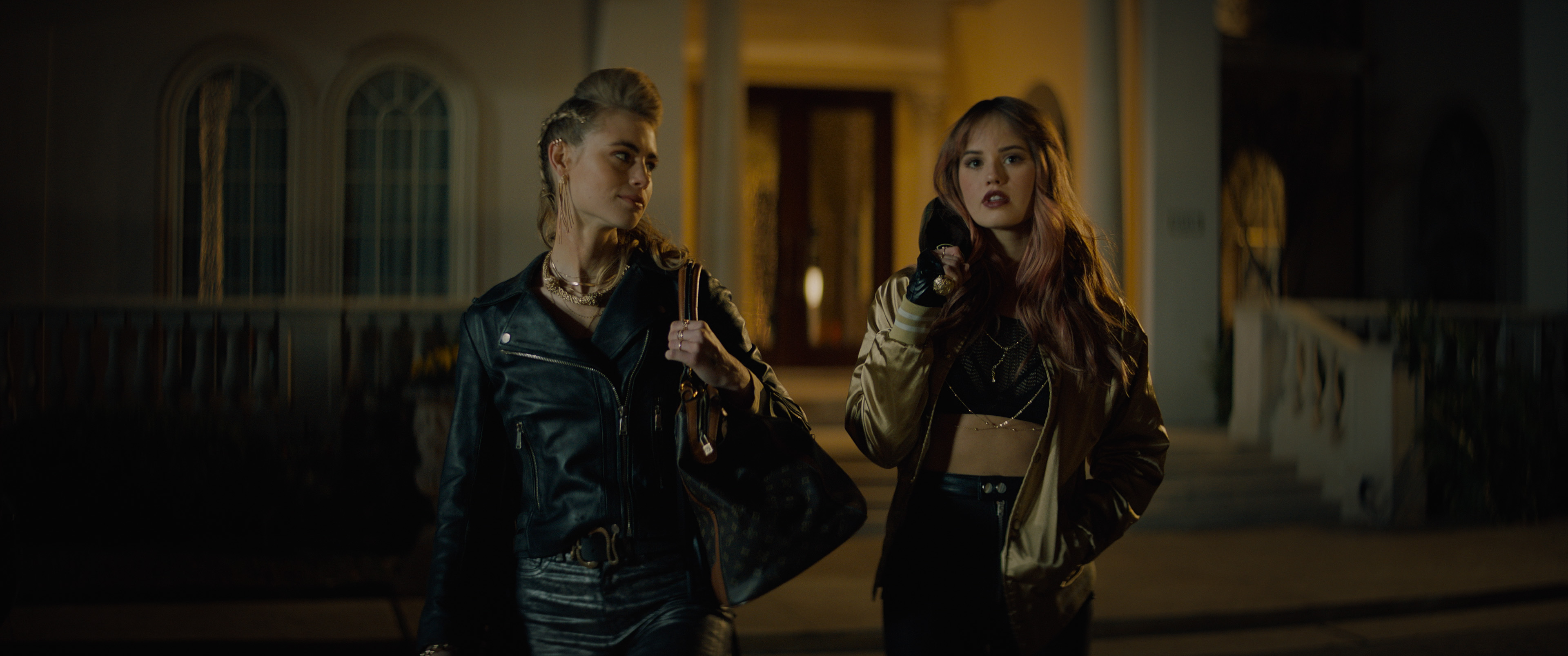 Debby Ryan and Lucy Fry in Nanh Sắc Trong Đêm (2021)