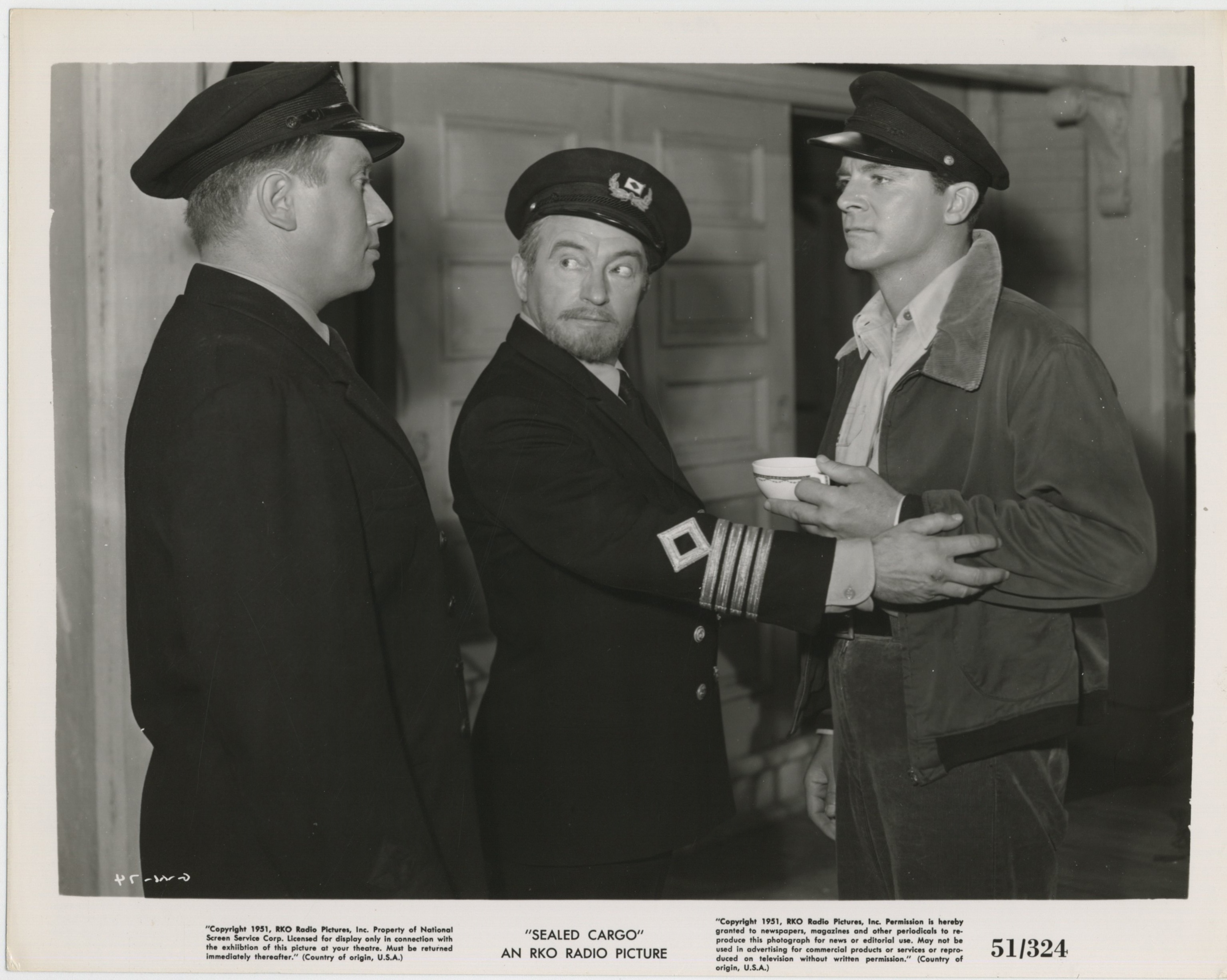 Dana Andrews, Claude Rains, and Henry Rowland in Sealed Cargo (1951)