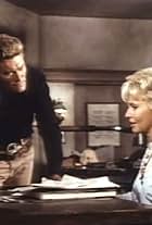 Lola Albright and Chuck Connors in Branded (1965)