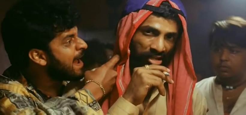 Manoj Bajpayee, Snehal Dabi, and Makrand Deshpande in Satya (1998)