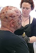 Midian Crosby applying a silicone zombie makeup at Event for Free Comic Book Day 2012 at I Want More Comics Thornton CO. 