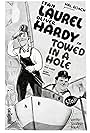 Oliver Hardy and Stan Laurel in Towed in a Hole (1932)