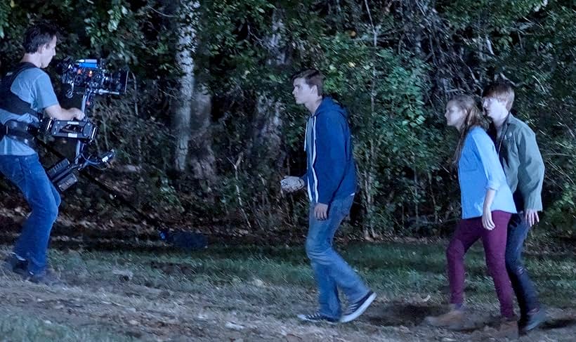 John Murlowski, Calum Worthy, Joel Courtney, and Andi Matichak in Assimilate (2019)