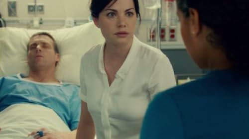 Michael Shanks and Erica Durance in Saving Hope (2012)