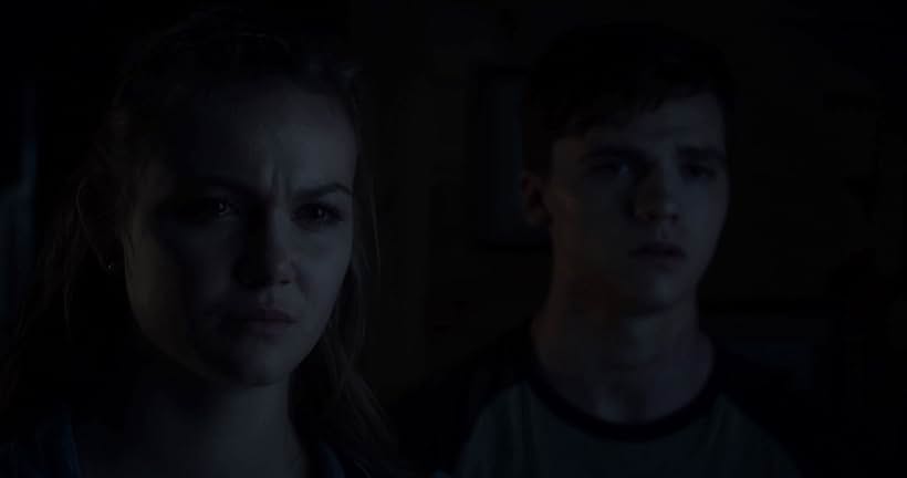 Joel Courtney and Andi Matichak in Assimilate (2019)