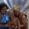 Rick Moranis, Rosie O'Donnell, Hlynur Sigurðsson, and Marinó Sigurðsson in The Flintstones (1994)