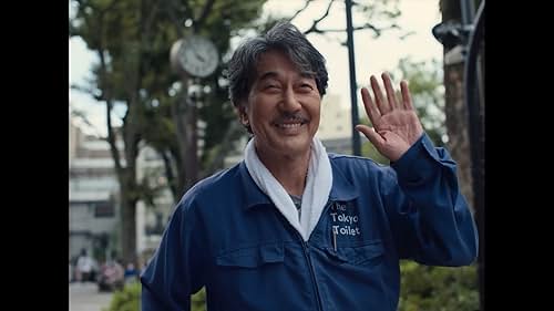 A janitor in Japan drives between jobs listening to rock music.