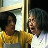 Megumi Okina and Chikako Isomura in Ju-on (2002)