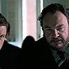 Lee Evans and John Rhys-Davies in The Medallion (2003)