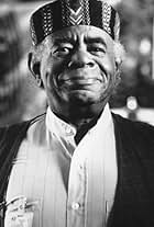 Roscoe Lee Browne in Dear God (1996)