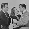 Gene Kelly, Deanna Durbin, and Dean Harens in Christmas Holiday (1944)