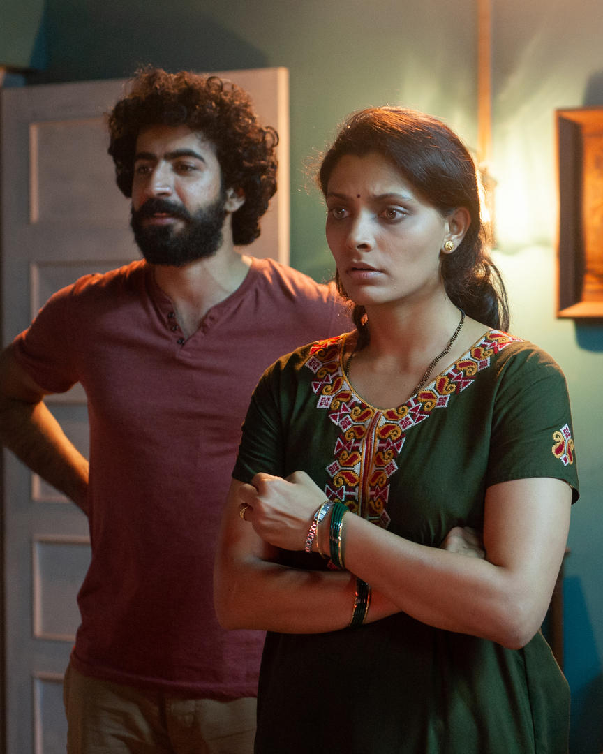 Saiyami Kher and Roshan Mathew in Choked (2020)