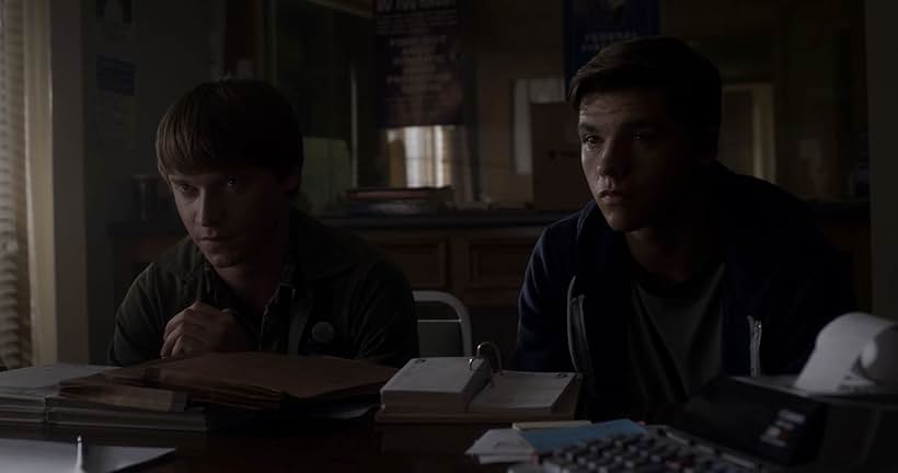 Calum Worthy and Joel Courtney in Assimilate (2019)