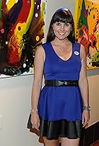 HOLLYWOOD, CA: Artist and filmmaker Andrea Fellers in front of her art at 'Hollywood Love Letters' Artist Reception - ArcLight Cinemas July 11, 2013 