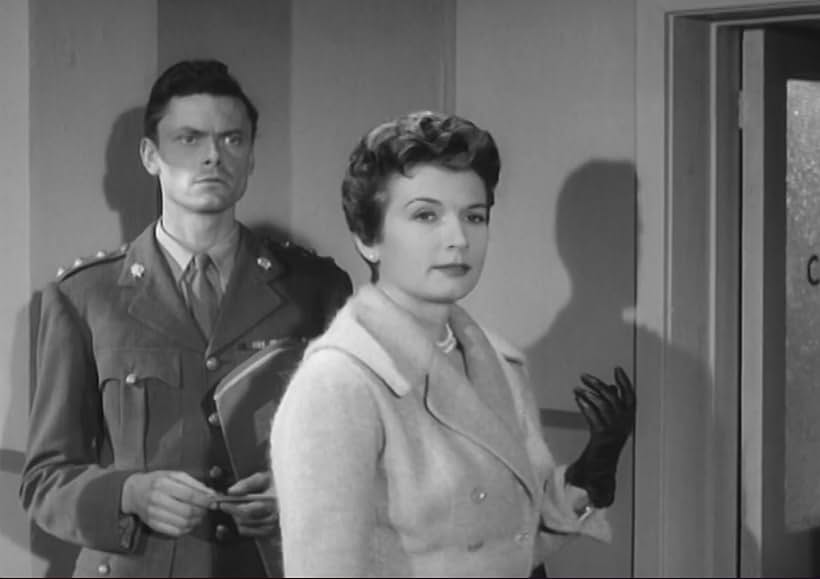 Robert Bruce and Carole Mathews in Assignment Redhead (1956)