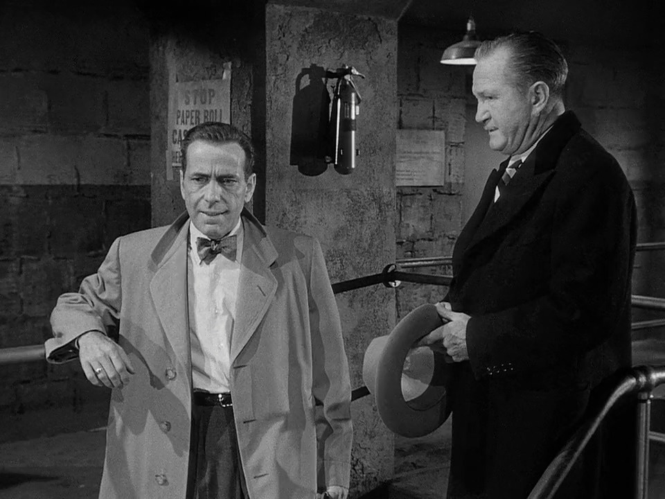 Humphrey Bogart and Tom Powers in Deadline - U.S.A. (1952)