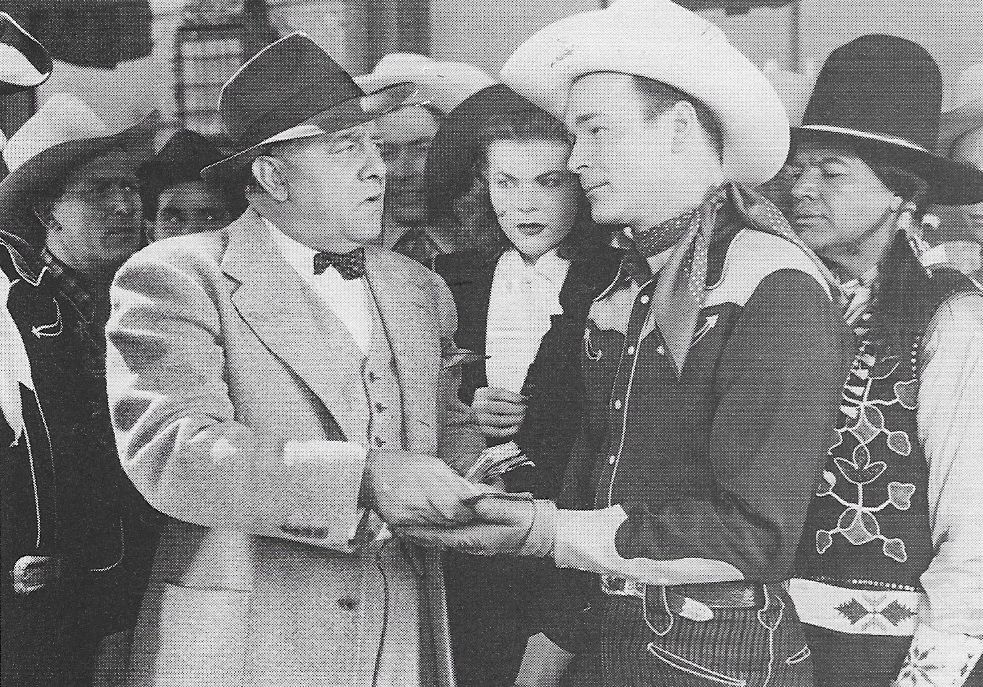 Roy Rogers, Ken Carson, Hugh Farr, Elaine Lange, Arthur Loft, and Charles Soldani in Man from Oklahoma (1945)