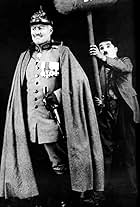 Charles Chaplin and Syd Chaplin in Cong Trai (1918)