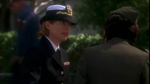 Dana Sparks as LT. Cmdr. Caroline Imes in JAG