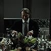 Caroline Dhavernas, Mads Mikkelsen, and Raúl Esparza in Hannibal (2013)