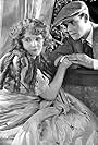 Lucille Ricksen and John Harron in Behind the Curtain (1924)