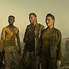 Kim Engelbrecht, Travis Fimmel, and Litha Bam in King (2022)