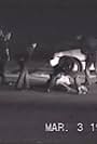 Rodney King, Laurence Powell, and Timothy Wind in Rodney King Beating Video (1991)