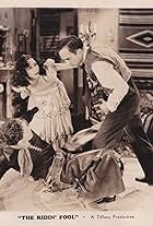 Ted Adams, Bob Steele, and Josefina Velez in The Ridin' Fool (1931)