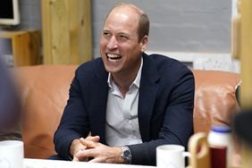 Prince William, Prince of Wales laughs during a visit to Faithworks Carpentry Workshop 